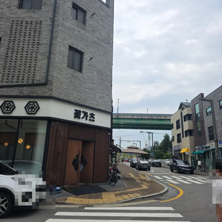 Public parking lot under the bridge to the right of the restaurant