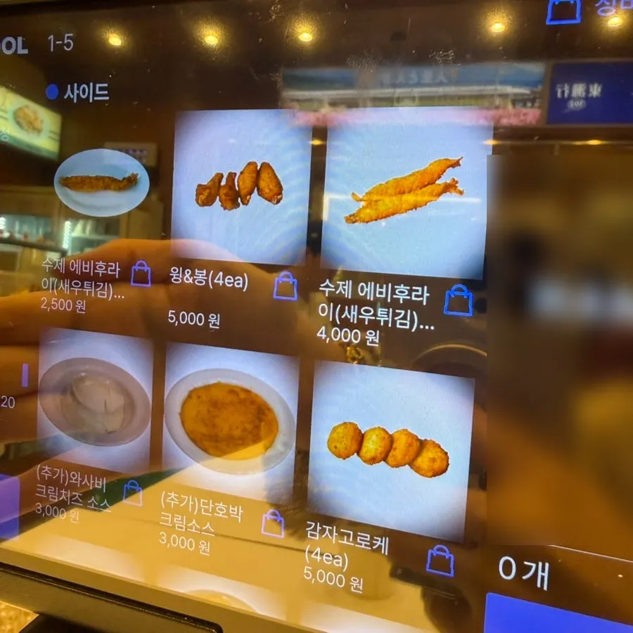 Menu board of pasta and udon dishes