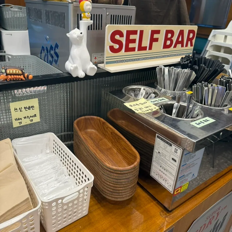 Self-serve bar where guests grab their own utensils