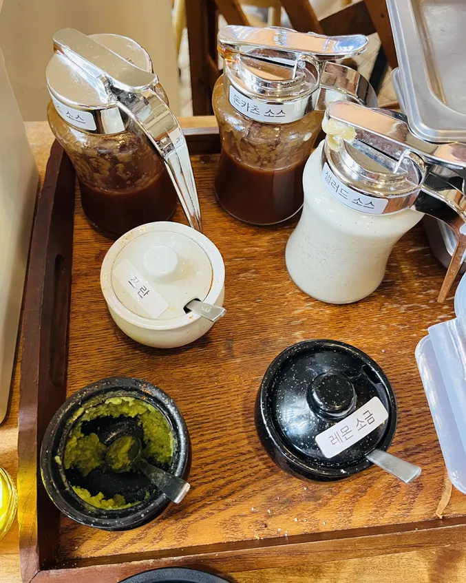Self-serve bar with house pickles and dried radish salad