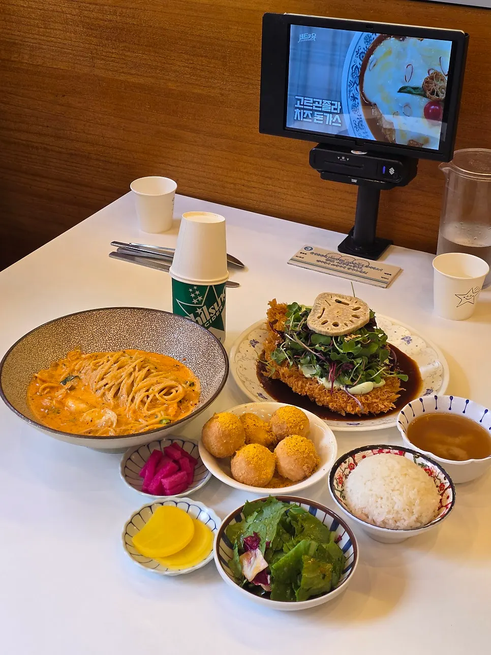 Tablet ordering screen showing discounted menu items