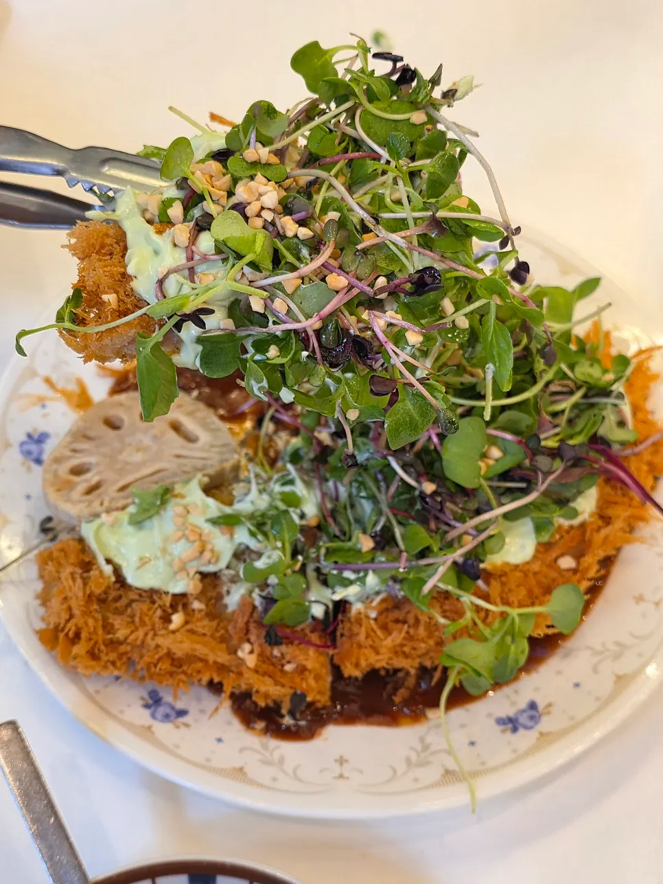 Close-up of the wasabi cream cheese pork cutlet on a wide plate