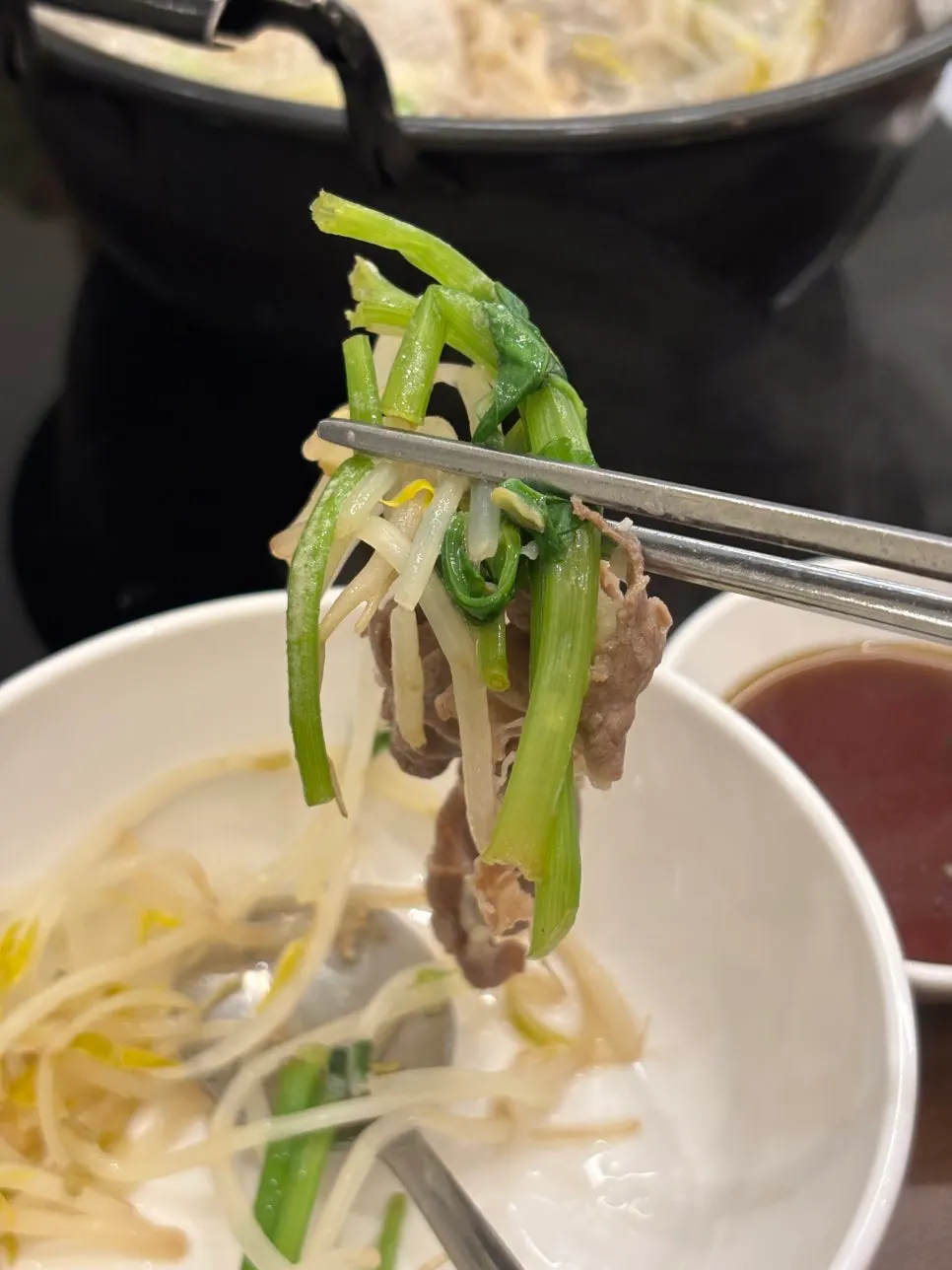 Shabu beef cooking in boiling broth