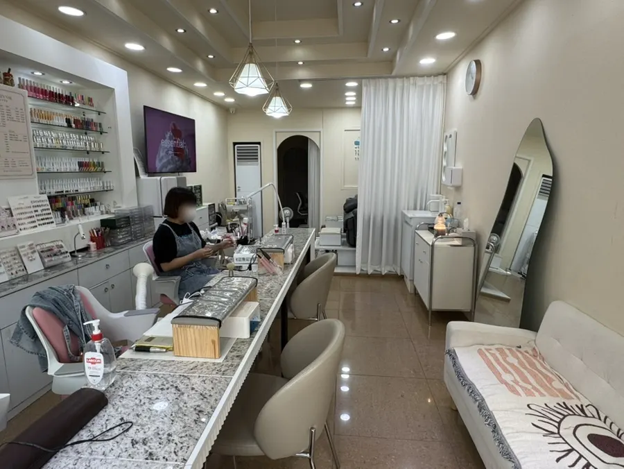 White-toned, modern interior of Green Nail