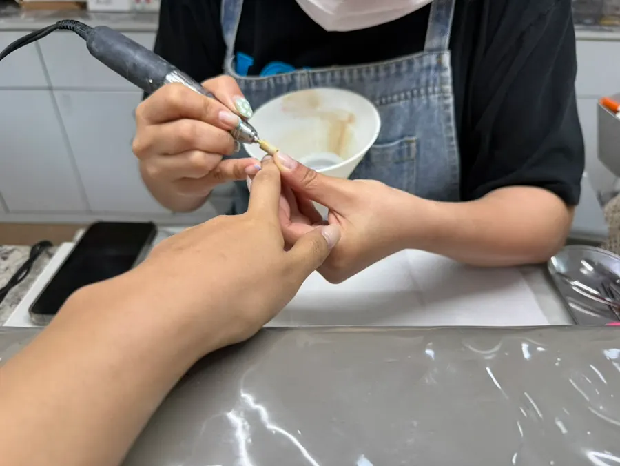 Nails undergoing the gel removal process