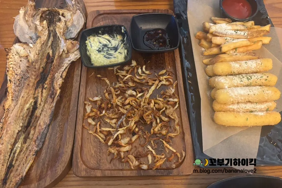 A plate of cheese sticks and fries