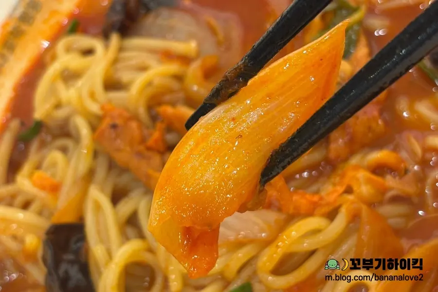 A spoonful of red jjamppong broth