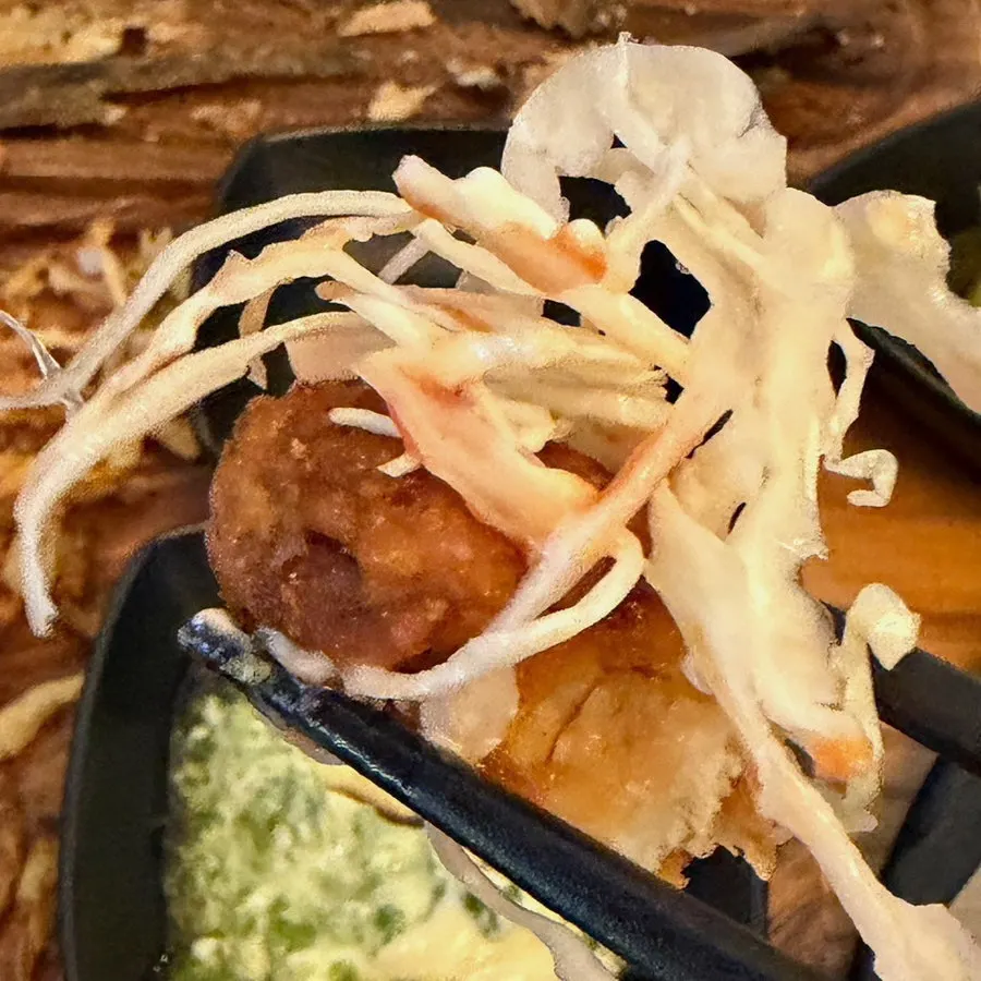 Boneless fried chicken, fries, and cabbage salad