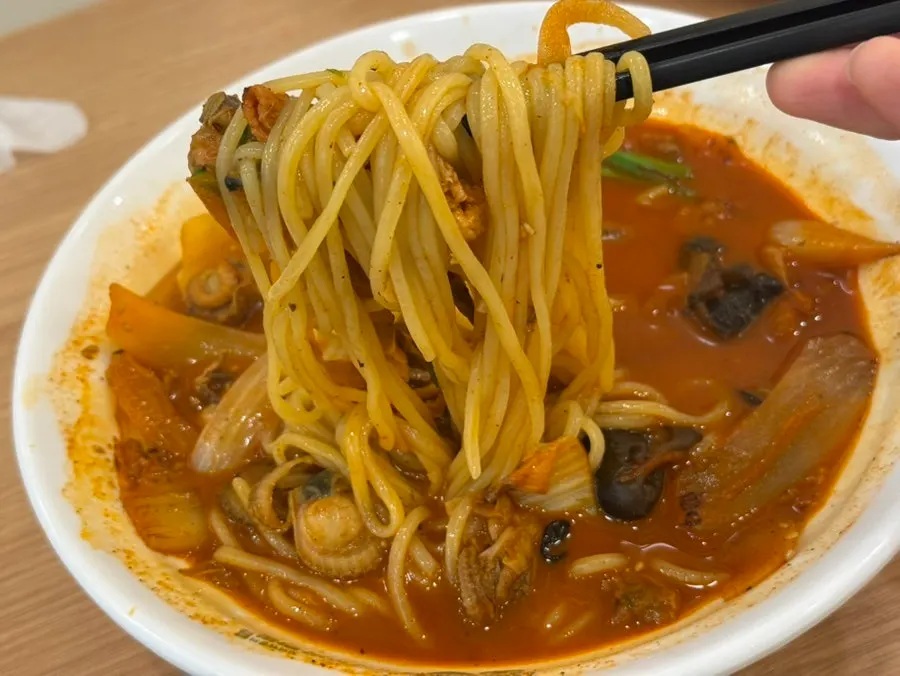 Close-up of jjamppong with spicy seafood broth