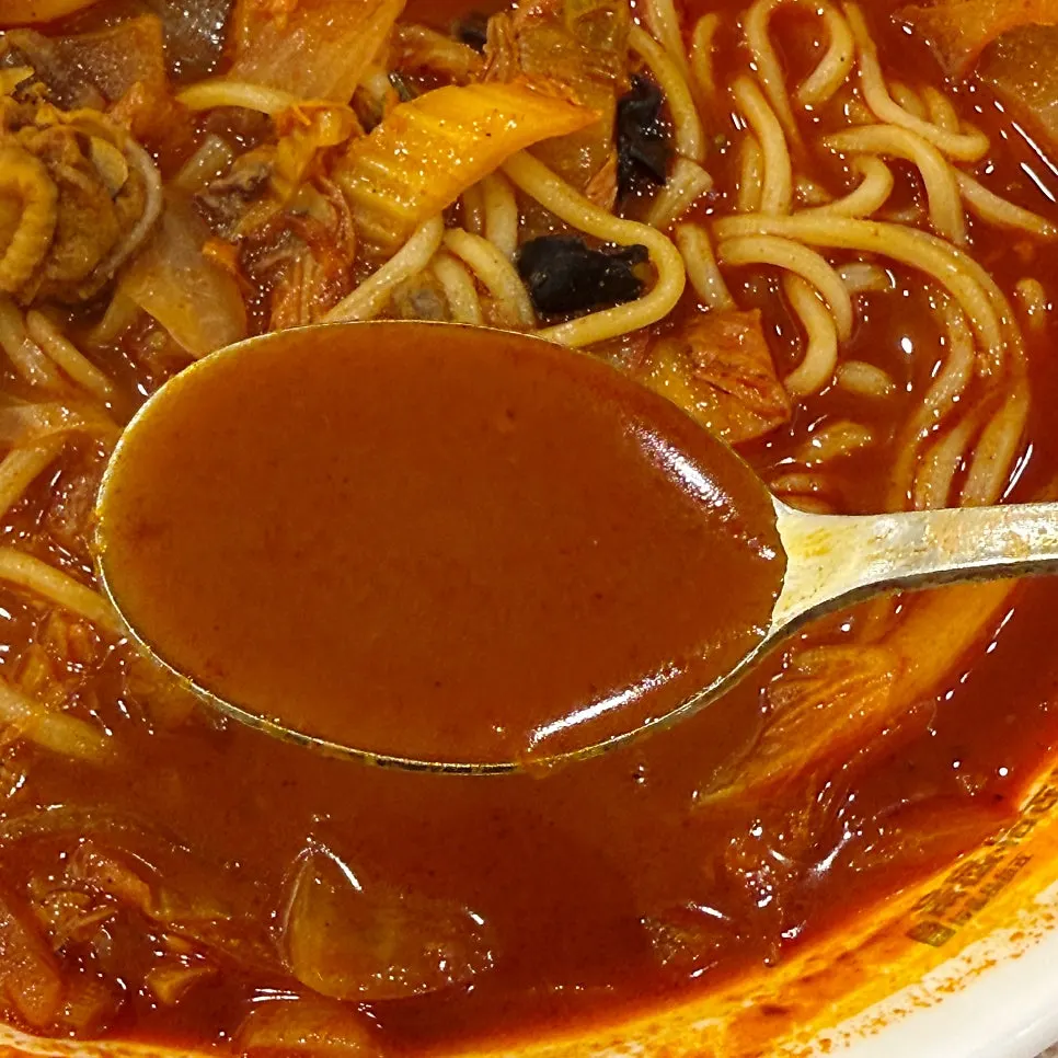 Close-up of the rich red broth of the cockle jjamppong