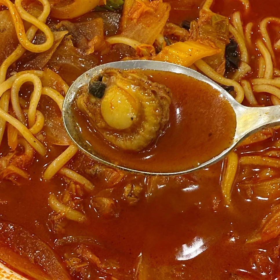 A cockle fished out from the broth