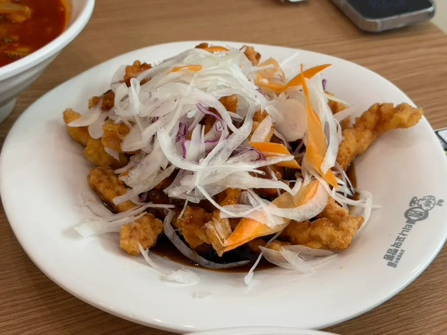 A spoonful of rice mixed into the jjamppong broth