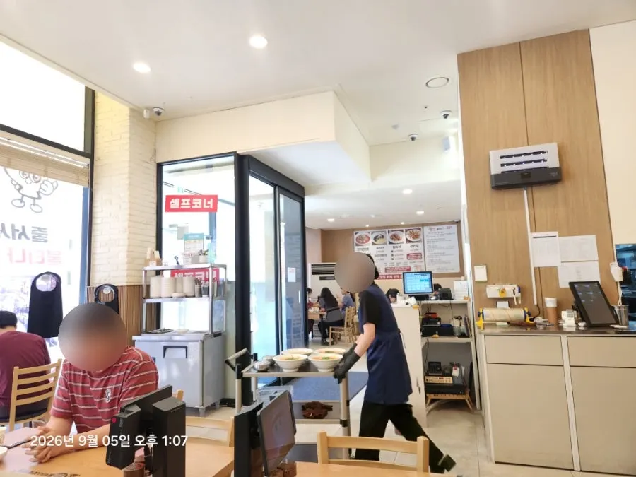 Interior of the Chinese restaurant packed with lunchtime customers