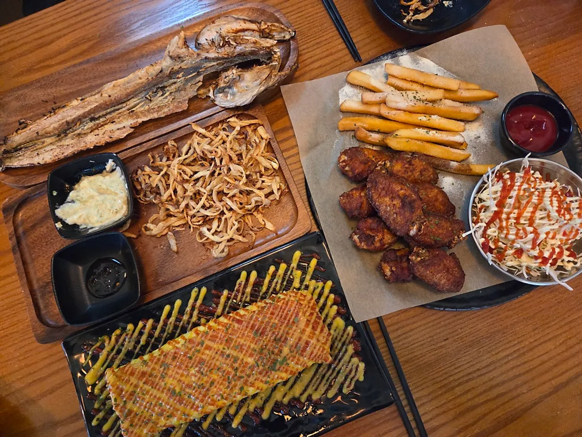 Snacks and beer laid out on the table
