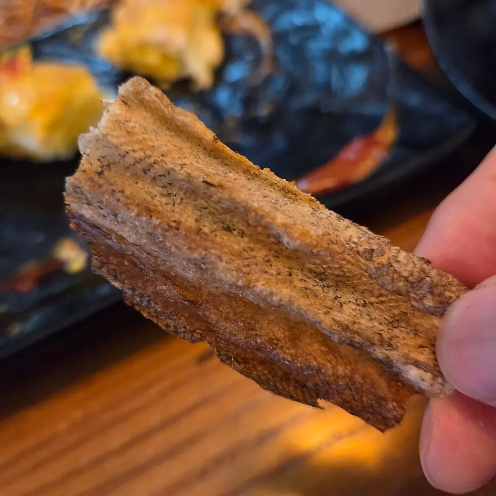 Crispy flesh and skin of the grilled dried pollock