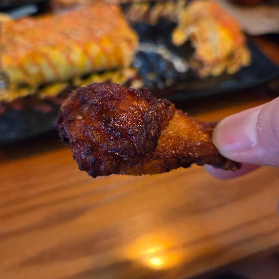 Spicy red wing dipped in cheongyang chili mayo sauce