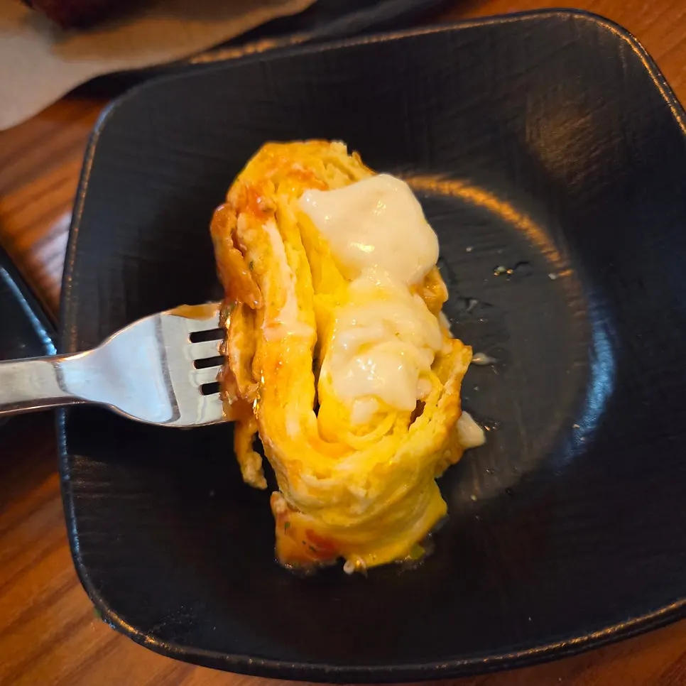 Cheese stretching from the mozzarella egg roll