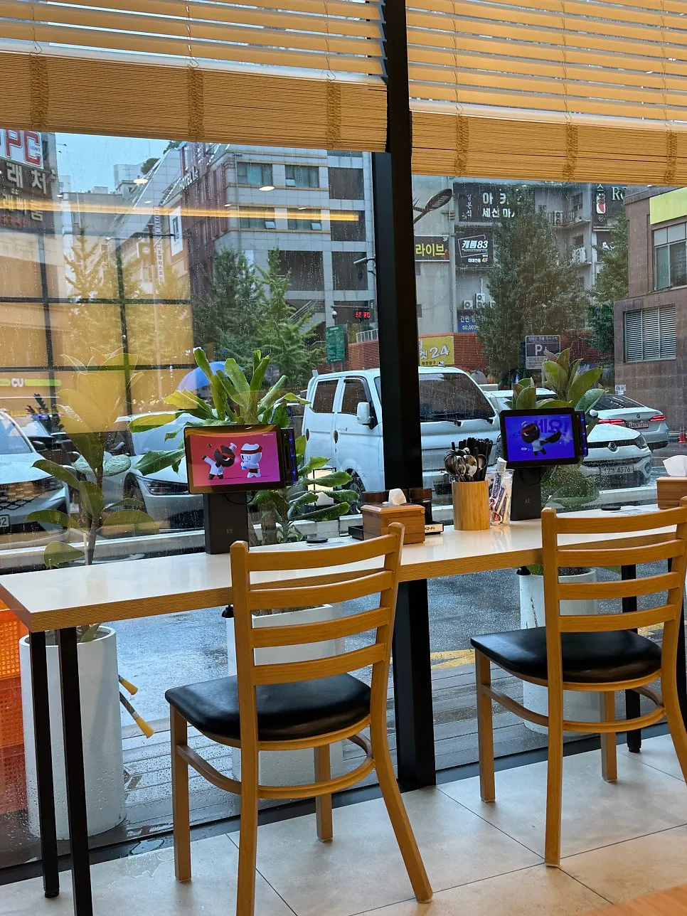 Restaurant interior seating full of lunchtime customers