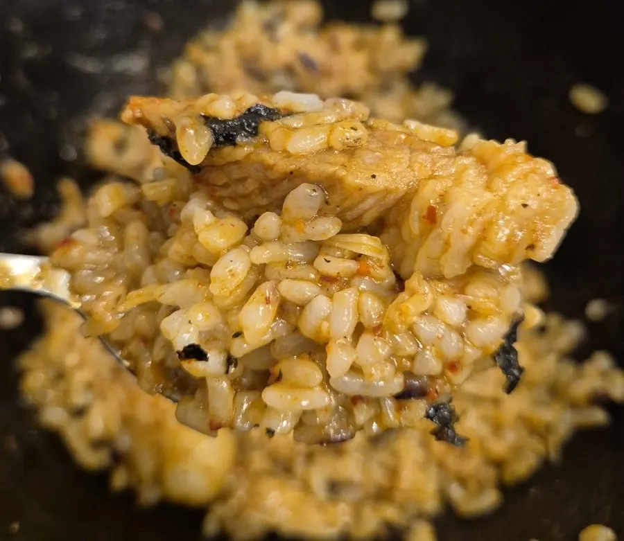 Rice mixed with duruchigi sauce and seaweed flakes in a bowl