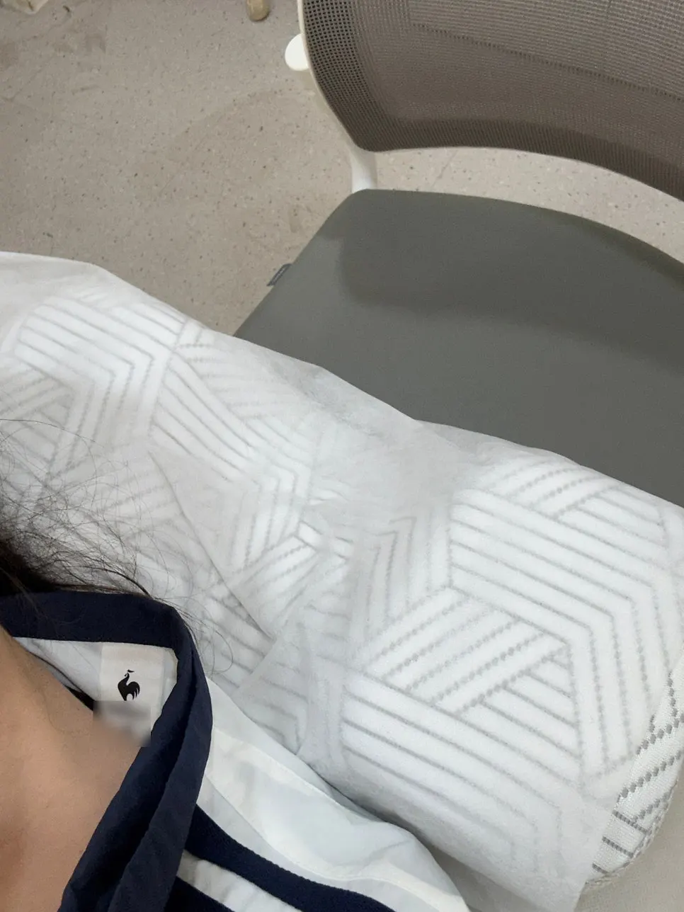 Treatment bed prepared with a cervical pillow