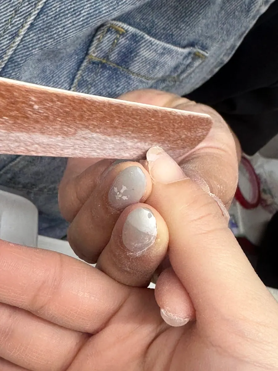 Nail care shaping nails into a square
