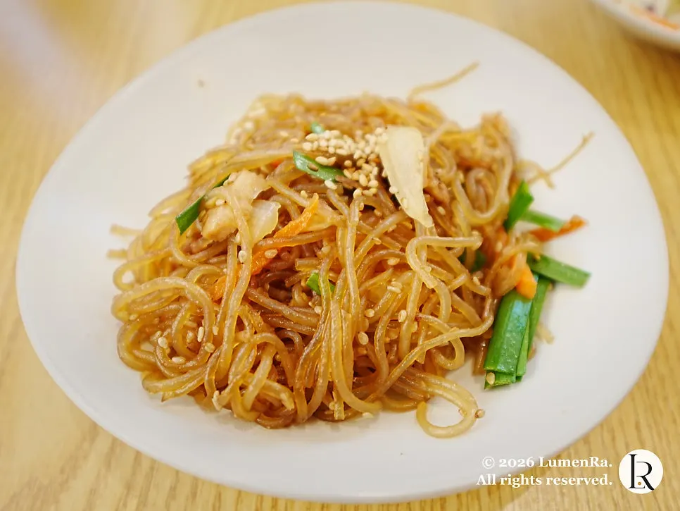 Japchae side dish on a Korean meal table