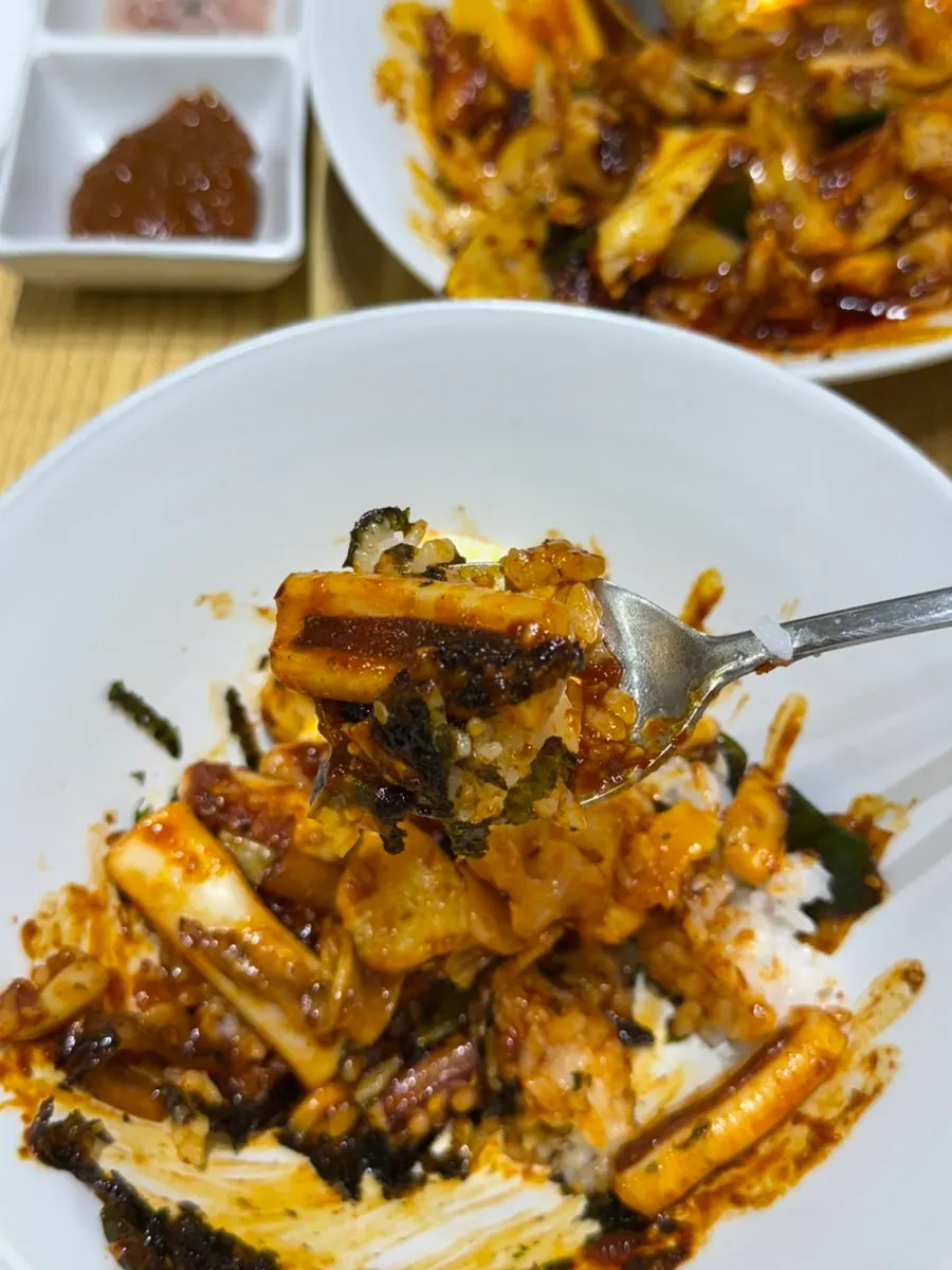 Soft-cooked egg served with stir-fried squid
