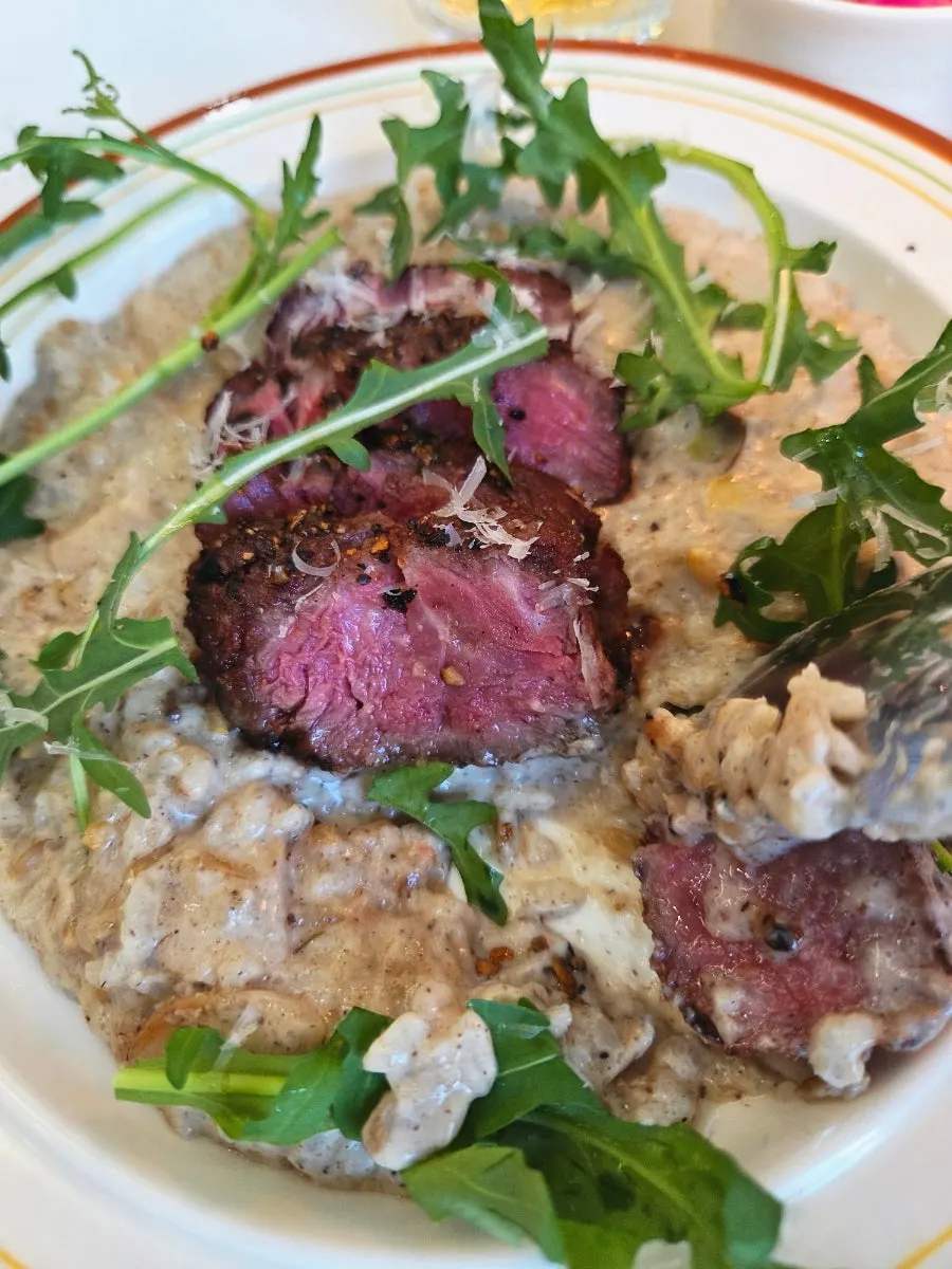 Risotto topped with thick steak