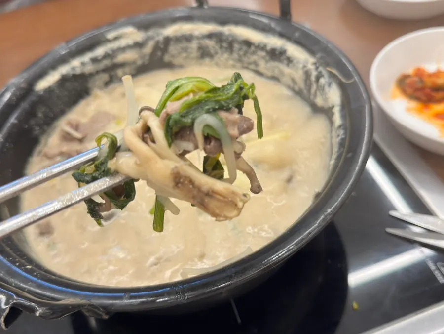 Meal of broth, meat, and vegetables