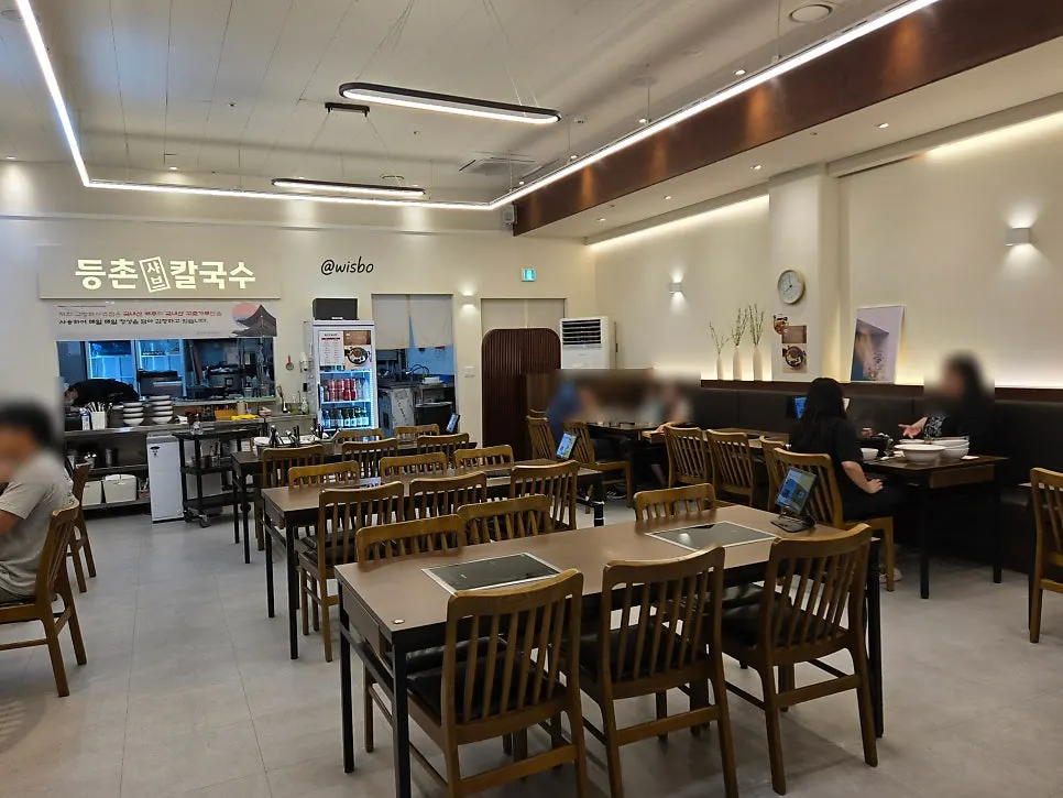 Clean wood-tone table layout inside the restaurant