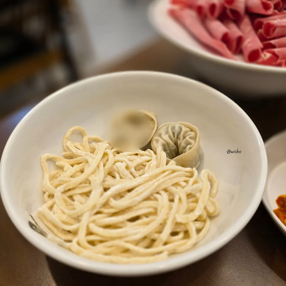 Plate of kalguksu noodles and dumplings