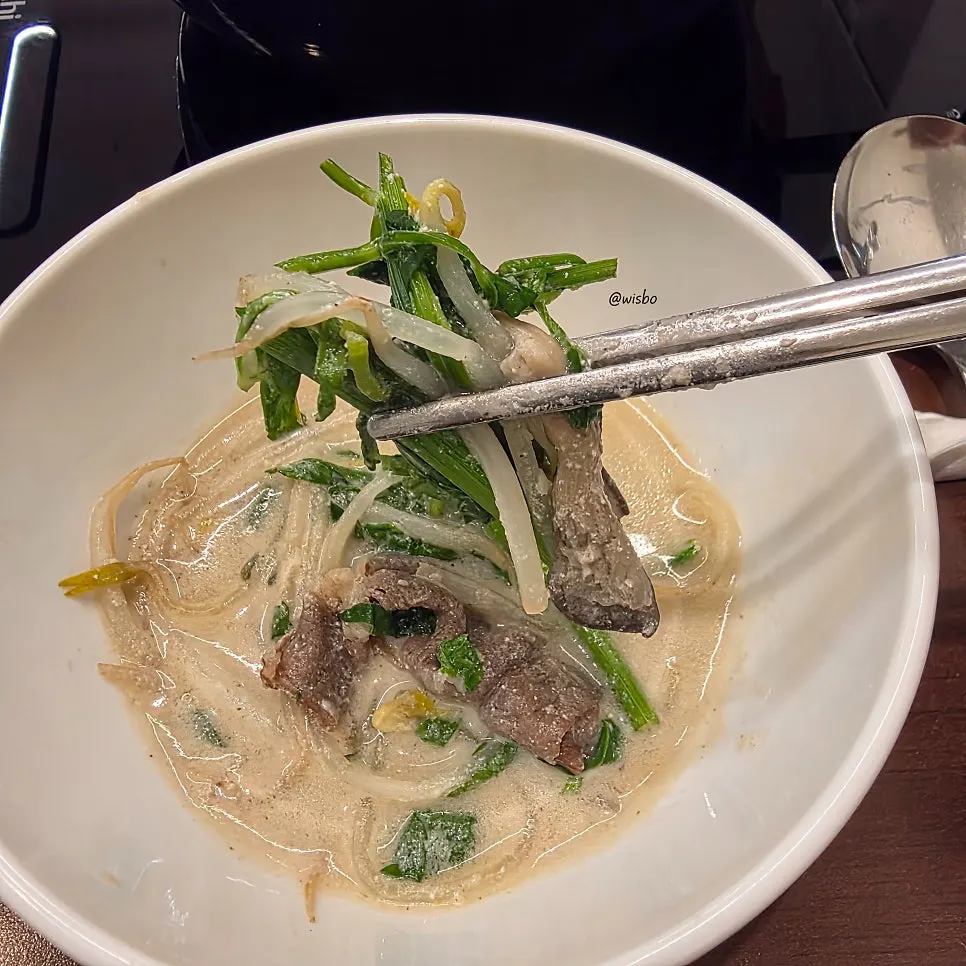 Shabu-shabu beef dipped in soy sauce