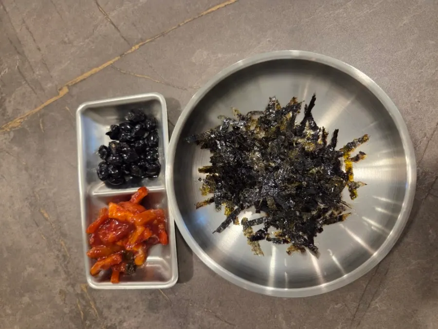 Meal with seaweed flakes and a bowl of rice