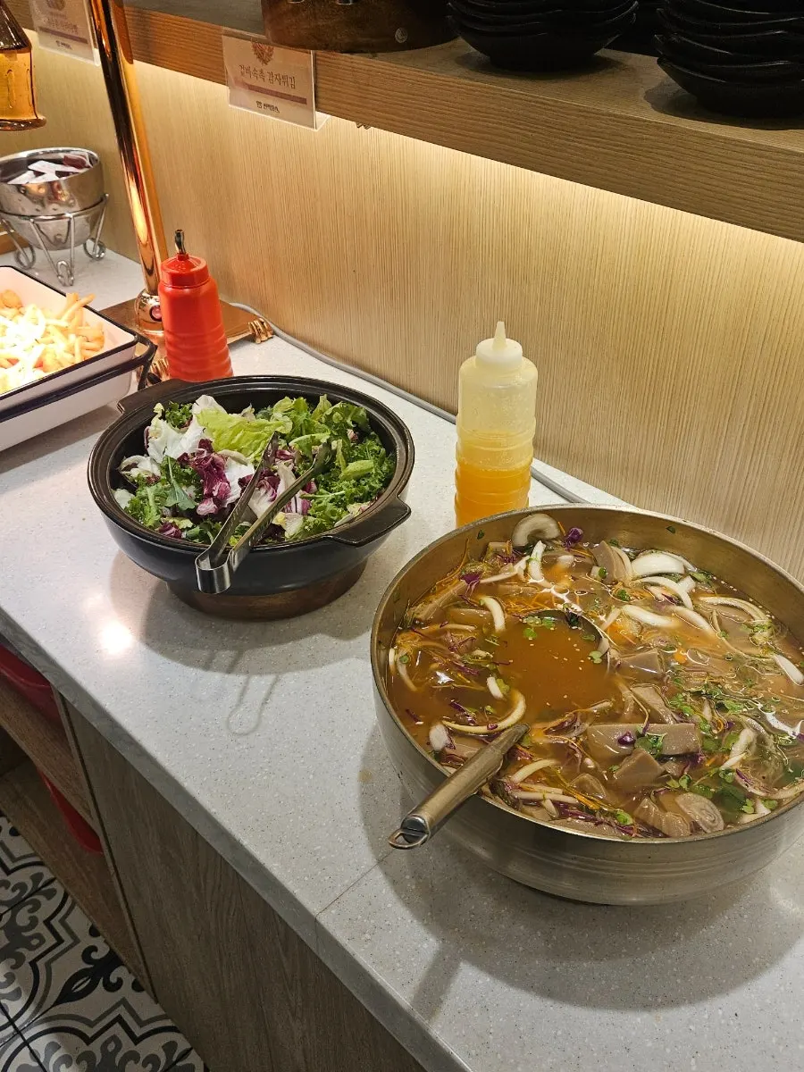 Fried rice, tteokbokki, and spaghetti at the salad bar