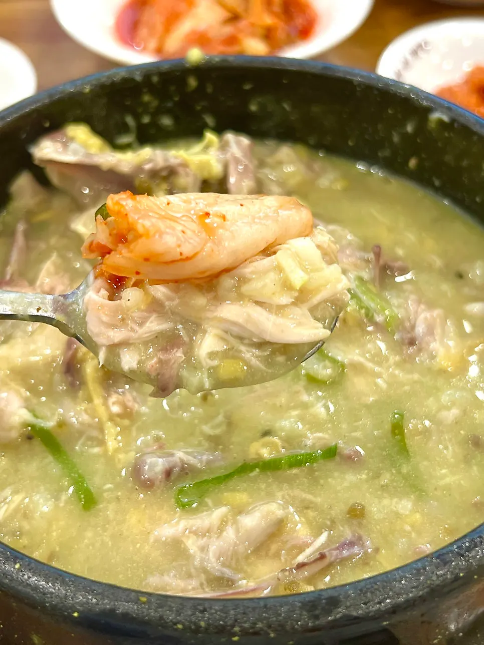 The thick broth of the mung bean samgyetang