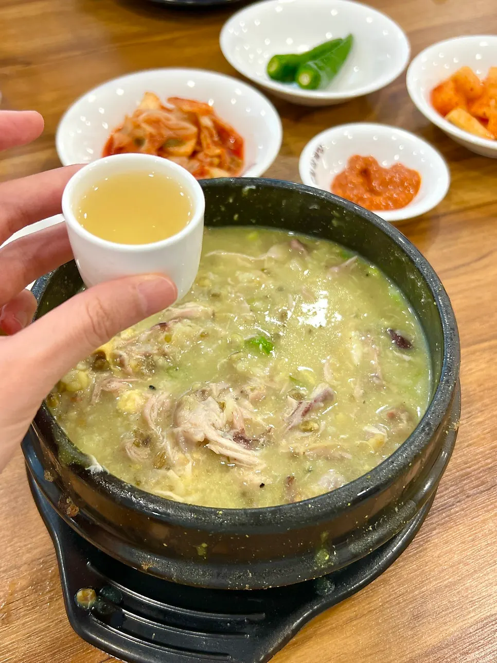 Samgyetang spread enjoyed as a family meal