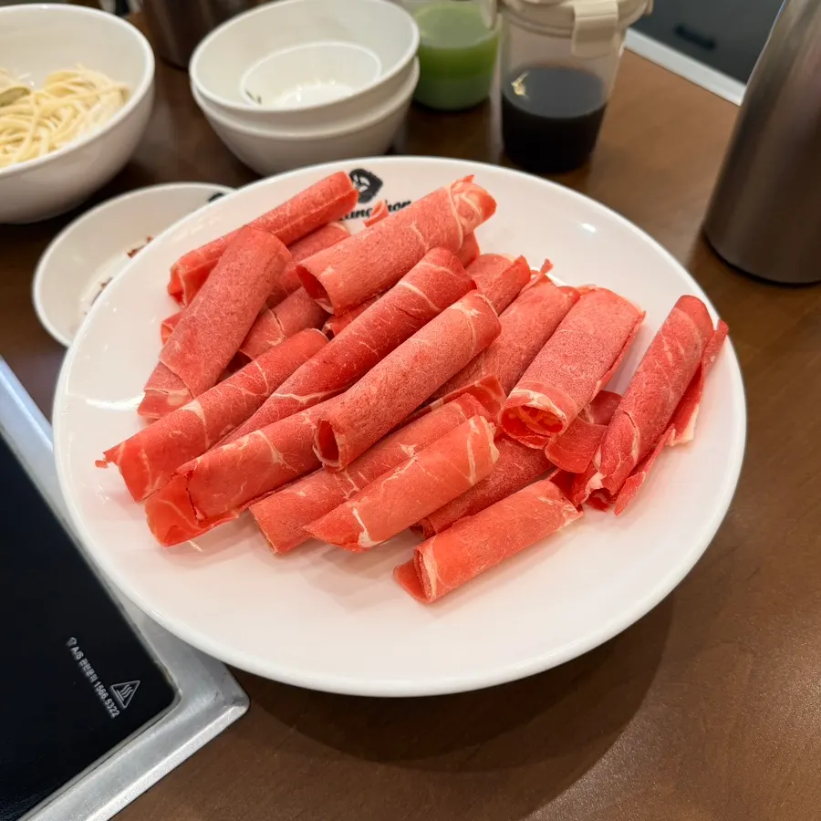 A plate of thinly sliced shabu beef