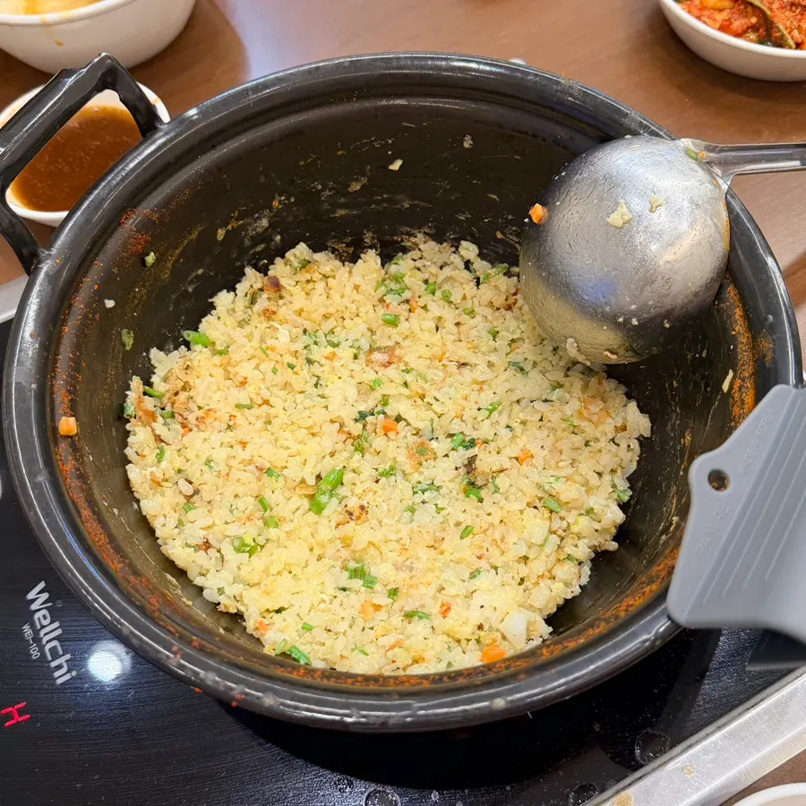 Stir-frying rice and egg in the leftover broth