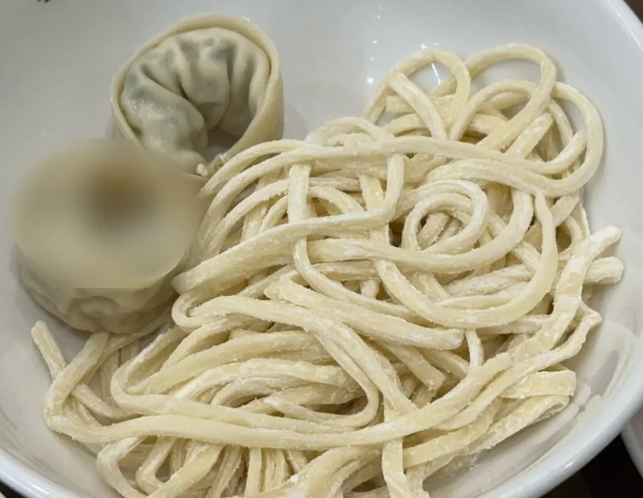 Plate of kalguksu noodles and dumplings