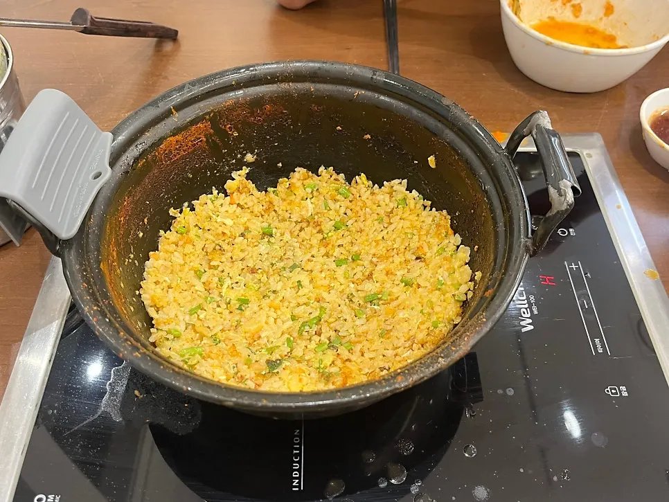 Finishing fried rice cooked in the kitchen