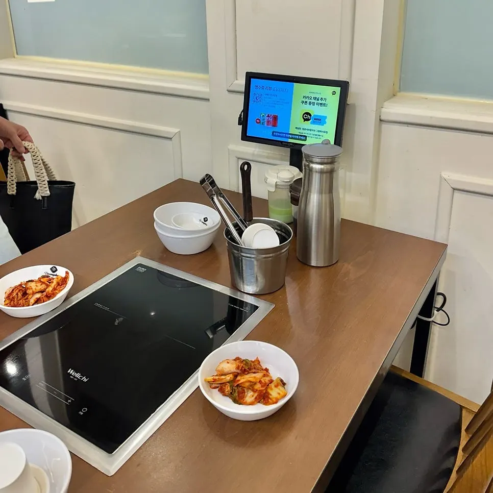 View of tables inside Deungchon Shabu Kalguksu