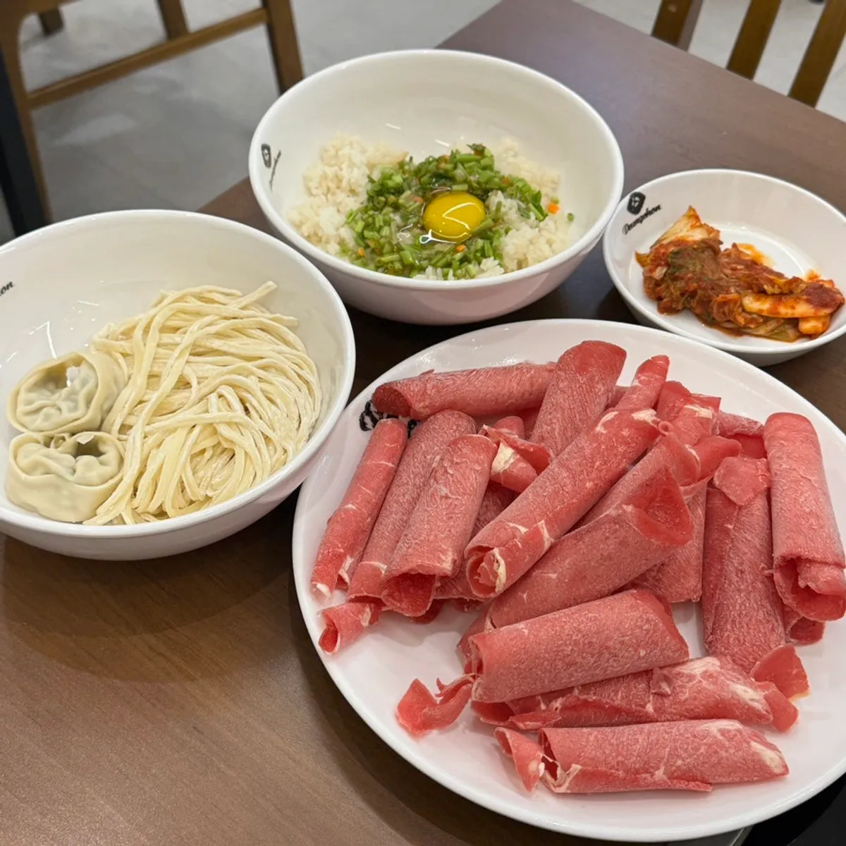 Shabu-shabu table spread loaded with minari