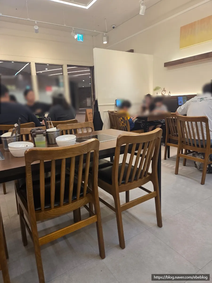 Shabu-shabu table seating with a pot in the center