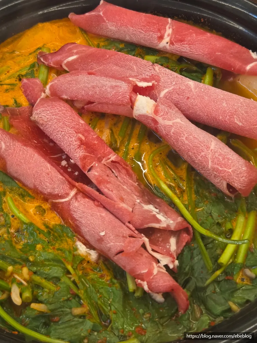 Plate of cooked meat and vegetables scooped out