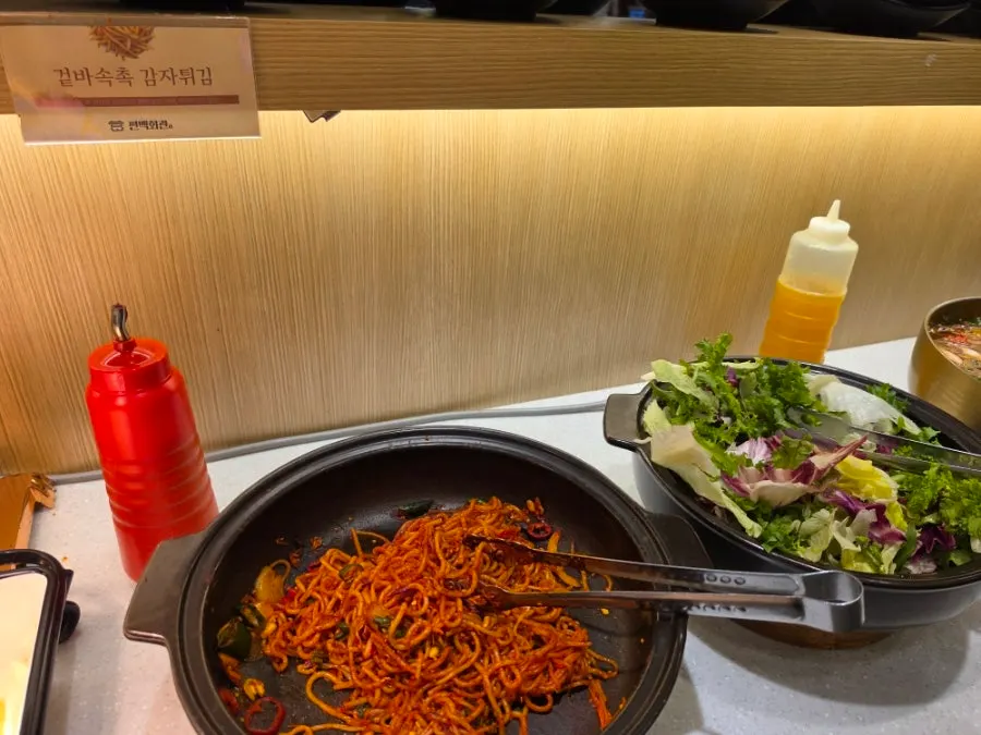 Self-bar stocked with fresh shabu-shabu vegetables