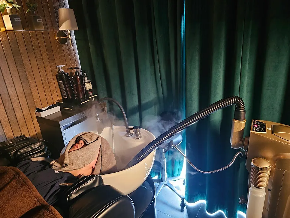 Scalp steam treatment received while lying on the massage chair