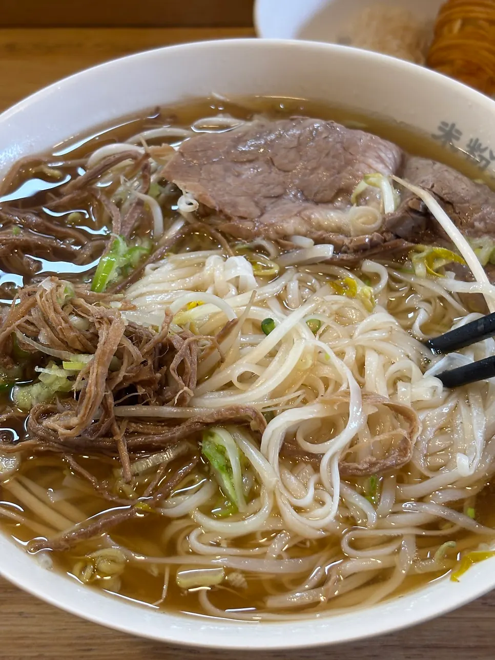 Tendon pho piled high with meat topping