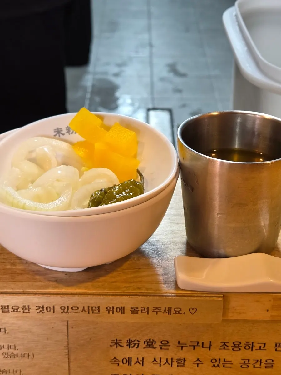 Water and side dishes set up at each table