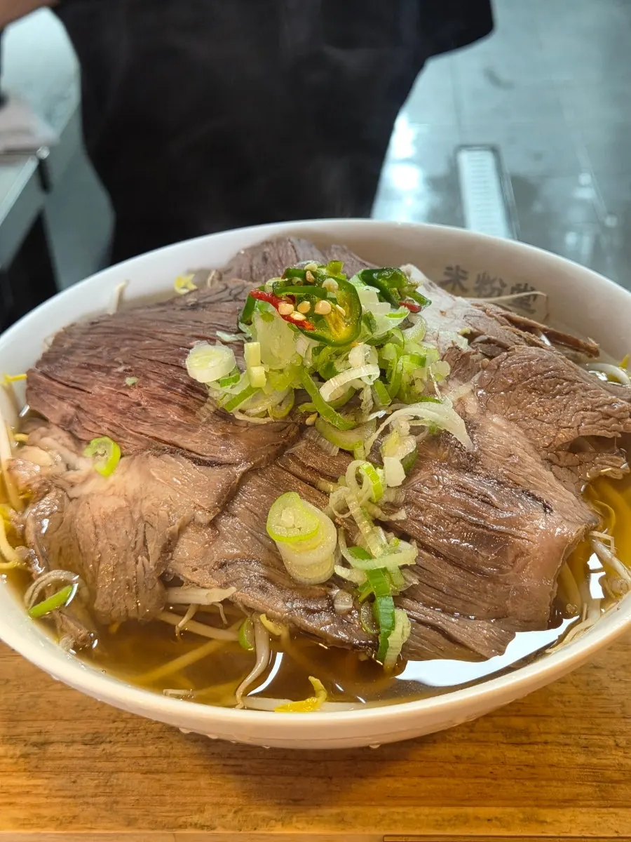 Brisket pho piled high with thinly sliced brisket