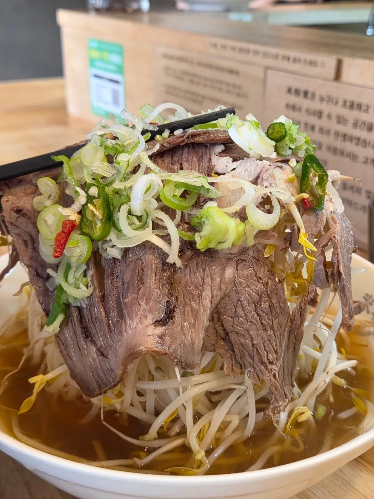 A generously filled bowl of Mibundang pho